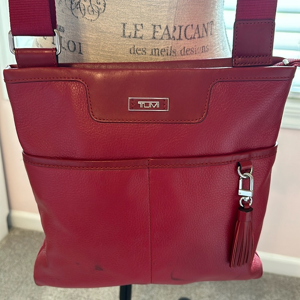 Red Tumi cross body bag